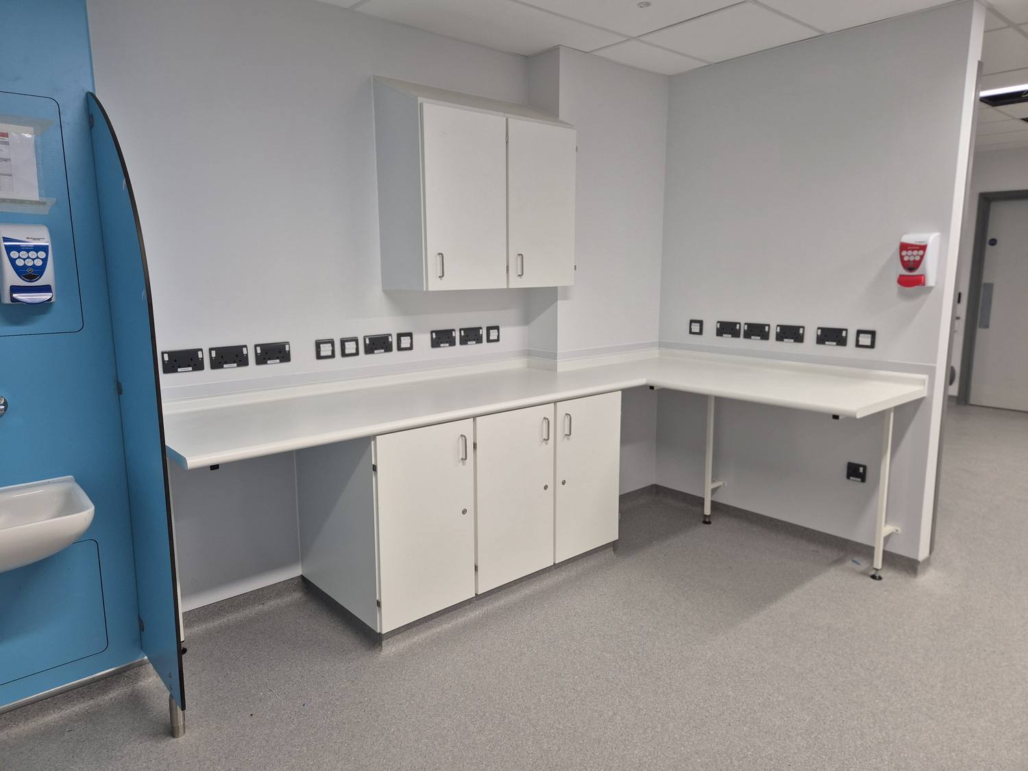 Staff base station with worktops and cabinetry